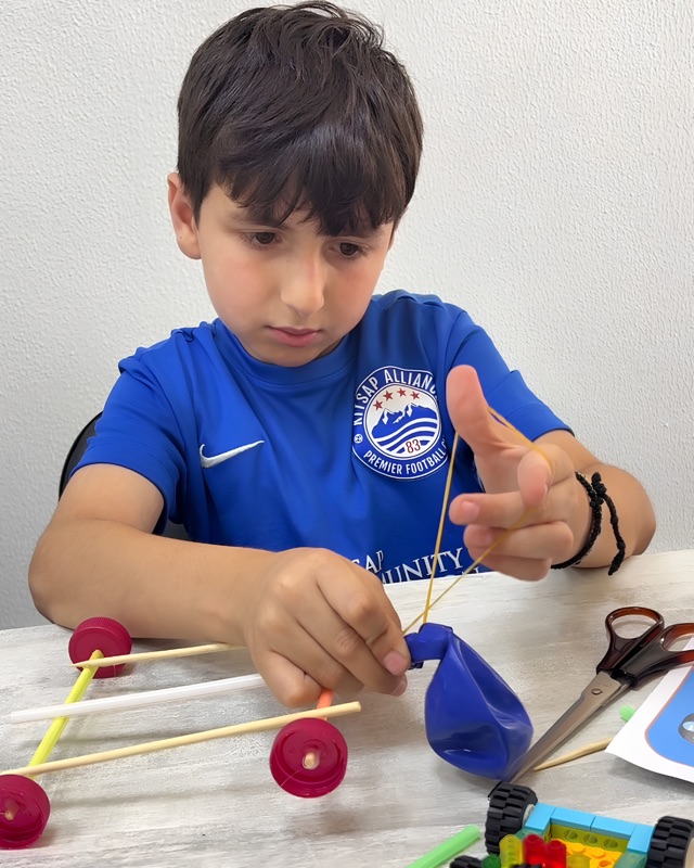 RoboStars student assembling a DIY maker project