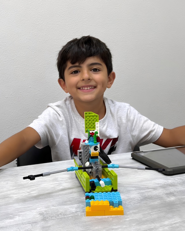 RoboStars student working on a robotics build